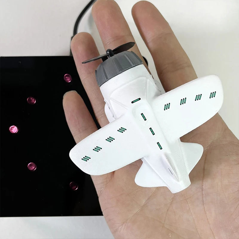 "Creative Floating Airplane Alarm Clock: A Touch of Technology and Style!"